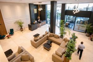 an overhead view of a lobby with couches and plants at NearYo Hotels in Marrakesh