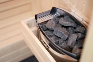 a container of charcoal in a drawer in a kitchen at SPA Apartment Adriatico in Rijeka
