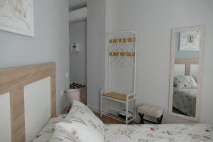 En eller flere senge i et værelse på Apartamento Fama