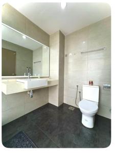 a bathroom with a toilet and a sink and a mirror at Setapak Central Mall Bathtub & Netflix in Kuala Lumpur