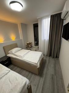 a hotel room with two beds and a window at Station House EVN in Yerevan +17 photos