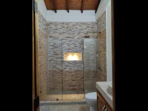 a bathroom with a shower with a glass door at Casablanca Hotel Boutique Salamina in Salamina +33 photos
