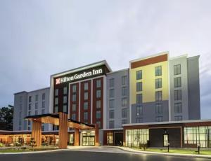 a rendering of a hotel called the hidden garden inn at Hilton Garden Inn Merced in Merced