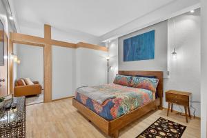 a bedroom with a bed and a cross on the wall at 302B Market View | European Village in Palm Coast