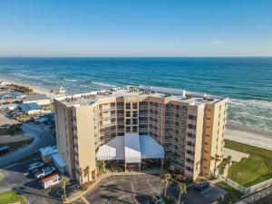 an aerial view of a hotel and the ocean at Oceanfront Beachside Condo - Pool, Beach, & Views in Chicken Island