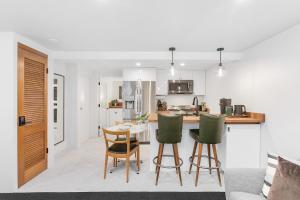 a kitchen and living room with a table and chairs at Sunnyside Studio on Green Lake in Seattle +11 photos