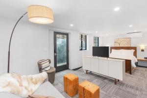 a bedroom with a bed and a living room at Sunnyside Studio on Green Lake in Seattle