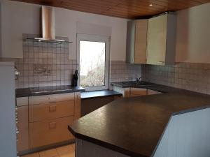 a kitchen with a counter top and a window at Wohnung in Waldnähe in Waltershausen