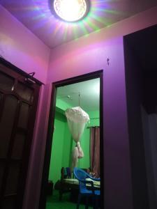 a room with a purple and green ceiling with a light at Bijayapur HomeStay & Apartment in Rānīpauwa
