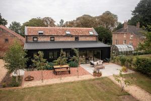 an aerial view of a house with a garden at The Granary Barn Retreat in Kings Lynn