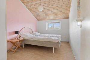 a small bedroom with a bed and a window at LN1939-Hjorring-Nordsovej-35 in Hjørring +13 photos