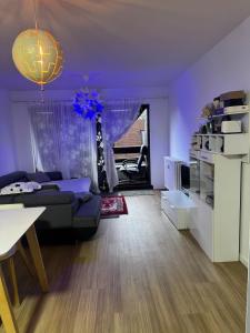 a purple living room with a couch and a table at Luxurious apartment in Auderghem in Brussels