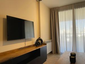 TV a/nebo společenská místnost v ubytování Departamentos Exclusivos by FAZ - Forja, Instituto, Atenas, Plaza de la musica, Estadio Kempes, Clinica Reina Fabiola, Sanatorio Allende - Ubicacion Estrategica