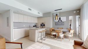 a kitchen and dining room with a table and chairs at Hyde Beach House 3BR2BA in Hollywood