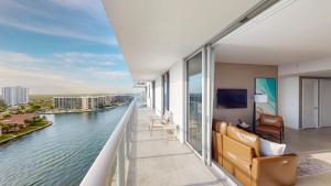a room with a balcony with a view of a river at Hyde Beach House 3BR2BA in Hollywood