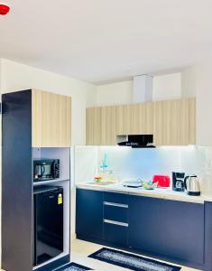 a kitchen with a blue and white counter top at ChicNest Studio in Ghaziabad