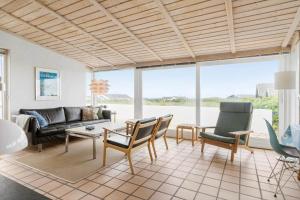 a living room with a couch and chairs at LN1963-Hirtshals-Klynen-19 in Hirtshals