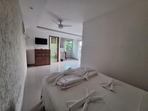 a white bedroom with a bed in a room at Sintonia com Mar in Angra dos Reis +24 photos