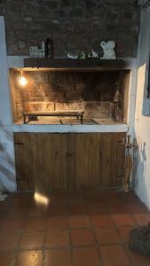 a kitchen with a wooden counter top in a room at La casa de Pedro in San Roque +21 photos