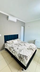 Ένα ή περισσότερα κρεβάτια σε δωμάτιο στο Flat Paulista 10