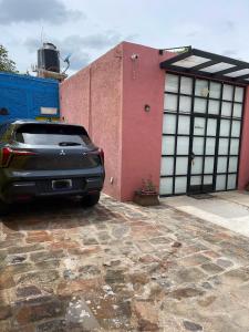 a car parked in front of a building at Loft cerca de todo con cochera in León