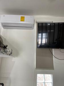 a kitchen with a stove and a window in a room at Loft cerca de todo con cochera in León