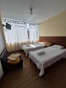 Postel nebo postele na pokoji v ubytování Villa Alegre
