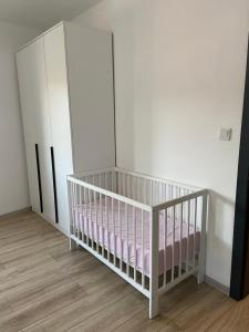 A bed or beds in a room at Sarajevo APARTMENT 7 -Free Garage-