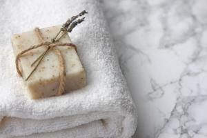 a piece of soap sitting on top of a towel at The Vanity Affair - Fitzrovia - By Frankie Says in London +3 photos