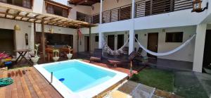 a swimming pool in the backyard of a house at Pousada Recanto de Safira Pipa in Pipa +45 photos