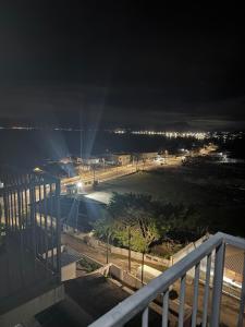 a view of a parking lot at night at Oceanfront apartment with beautiful view in Palhoça