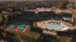 an aerial view of a large building with a swimming pool at Böden Hotel & Spa, AKEN SOUL in Villa General Belgrano