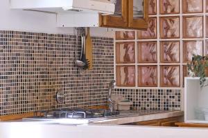 Kuchyň nebo kuchyňský kout v ubytování SMN-Duomo GuestHouse