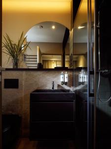 a bathroom with a sink and a mirror at SKARPA resort in Ustronie Morskie +71 photos
