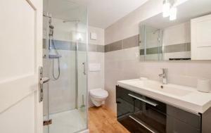 a bathroom with a shower and a sink and a toilet at Côté Jardin, Entre lac et montagne in Publier +2 photos
