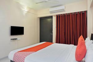 Postel nebo postele na pokoji v ubytování Hotel O Sai Inn + 15 fotografií