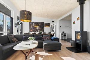 a living room with a couch and a table at SJ282-Haderslev-Podehaven-6 in Haderslev