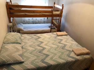 a bedroom with a bed and a bunk bed at Entire 3 bed rooms Apartment with Private wc ! in Samouco