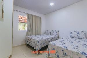 En eller flere senge i et værelse på Casa na Barra de Santo Antônio com piscina