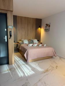 Giường trong phòng chung tại DMI Premium Apart Gdansk-Beach