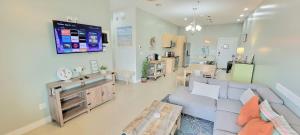 a living room with a couch and a table at La Isla F102 condo in South Padre Island
