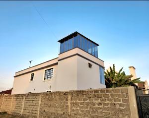 a lighthouse on top of a brick wall at JKIA and SGR Layover Guesthouse in Nairobi