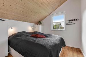 a bedroom with a bed and a window at C11322-Tarm-Sivsangervaenget-49 in Tarm