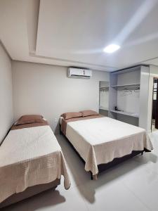 Ένα ή περισσότερα κρεβάτια σε δωμάτιο στο Studio 08 - 2K Atalaia Apenas150m da Orla