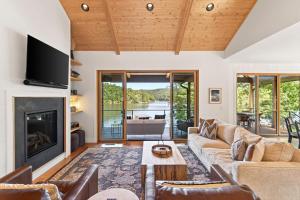 a living room with a couch and a fireplace at Dockside of the Moon in Nebo