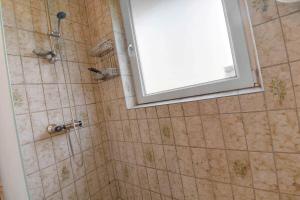 a bathroom with a shower with a window at C11410-Skjern-Sivvaenget-13 in Skjern +27 photos