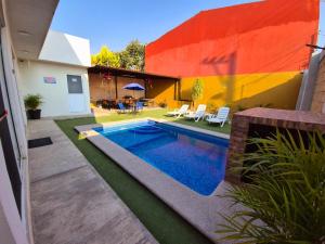 Bazén v ubytování Casa con alberca climatizada en Atlixco R nebo v jeho okolí