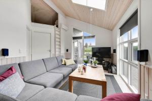 a living room with a couch and a table at C11418-Skjern-Rorkrogen-10 in Skjern