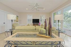 a living room with a couch and a table at Mother Ocean in Key West