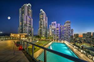 a pool on the roof of a building with a city skyline at 3BR Skyline Luxury with a 100 inch TV, Balcony & Prime Miami Location in Miami